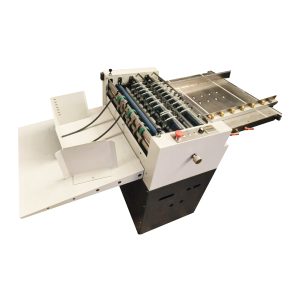 AUTOMATIC SLITTING, SCORER AND PERFORATION MACHINE